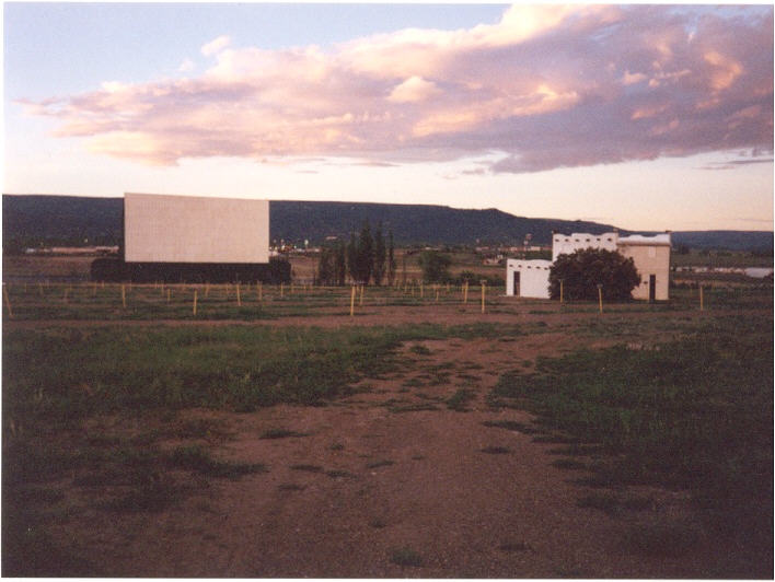 Screen and projection/concession building taken from back corner just past ticket booth.