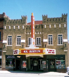 The downtown Raton Theatre closes in the summer and advertises the Drive-In; Sign says  85 Drive-In Now Open