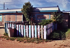 Rustic picket fence surrounding the projection portholes