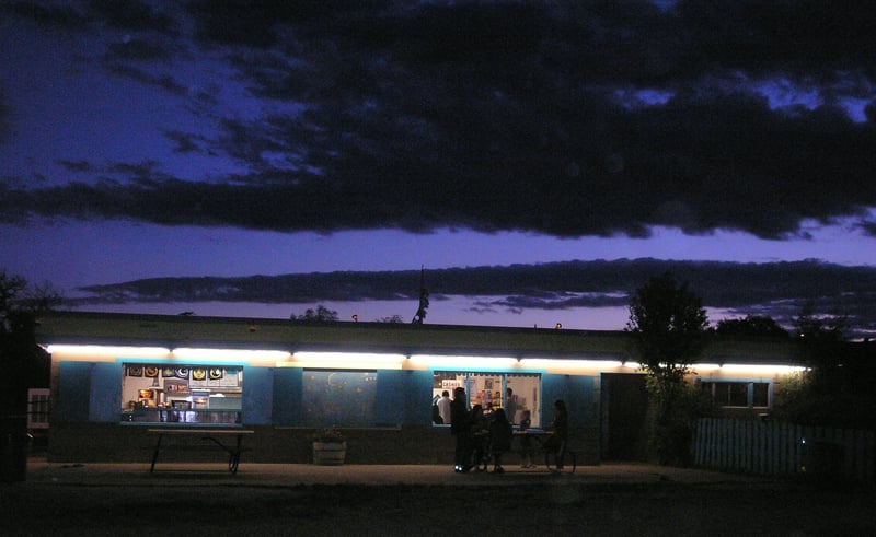 Ft. Union Drive-In concession stand at dusk.
