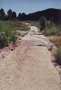 There's one road running along the perimeter left. The drive-in made use of the slope of the hill