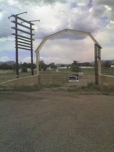 Site of the old Sundowner Drive in, Silver City New Mexico. Corrugated fence remains that was probably part of the drive in, however a manufactured homes/RV dealership has cleared out any indication of remains of the drive-in.