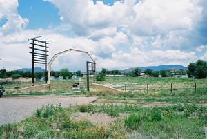 Possibly the front entrance, since the road is here.