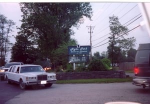 Marquee and line of cars waiting to enter.