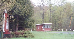 Entrance to the Mountain Drive-in Theatre, with vintage art deco circa 1948 marquee in foreground, at left, and ticketbooth in background.