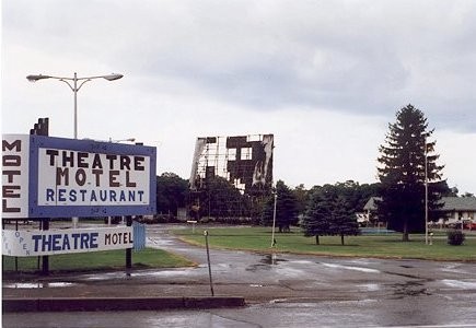 A unique property consisting of a drive-in theater, a motel, and a restaurant. The theater was destroyed in a fire during the late 1990's. Photo was taken shortly afer the fire.