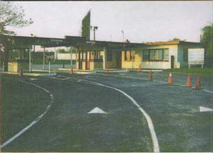 Ticket booths, managers office and one of three screens in background.