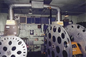 They have really big reels that hold about 3 hours of film. The reels are too big to be put on top of the projector. It's kind of like a platter, but you have to rewind the reels. They only use the projector on the right.