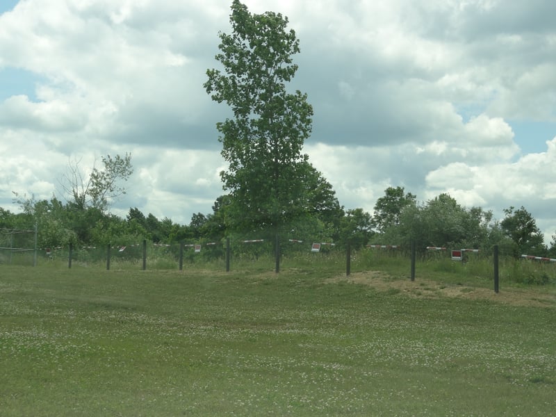 Empty field at former site