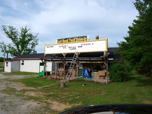 Drive in sign taken after a storm had damaged the screens.