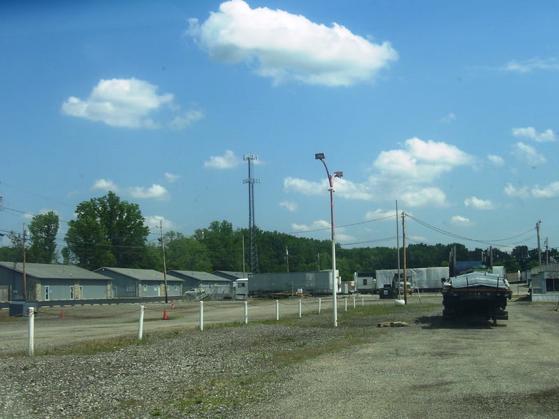 Looking down the entrance and the exit roads, the light posts are gone except for one, but I did notice that the 2 poles that were on each end of the screen with flashing strobe lights atop them to keep planes from hitting the screen are still there. The