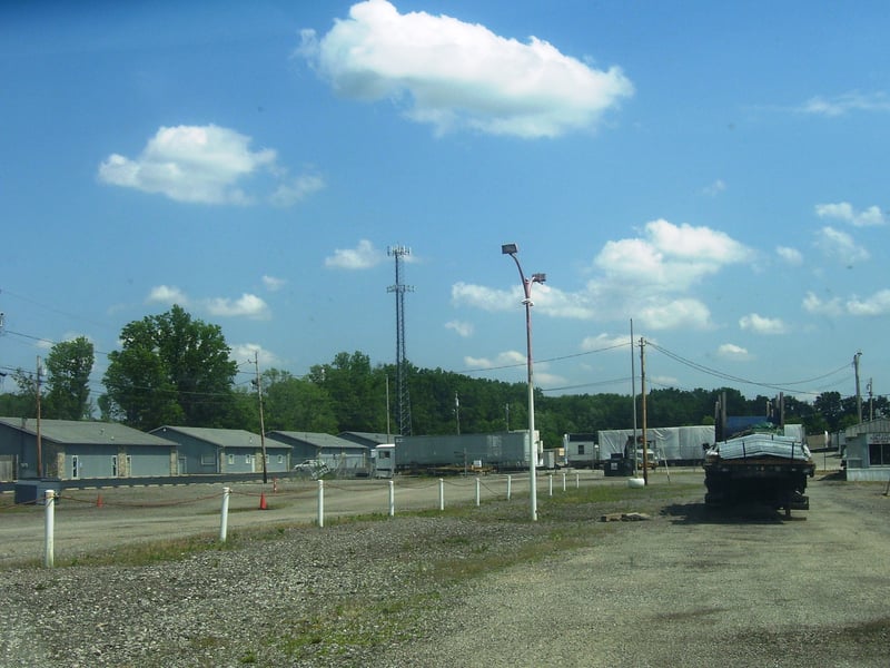 Looking down the entrance and the exit roads, the light posts are gone except for one, but I did notice that the 2 poles that were on each end of the screen with flashing strobe lights atop them to keep planes from hitting the screen are still there.  The