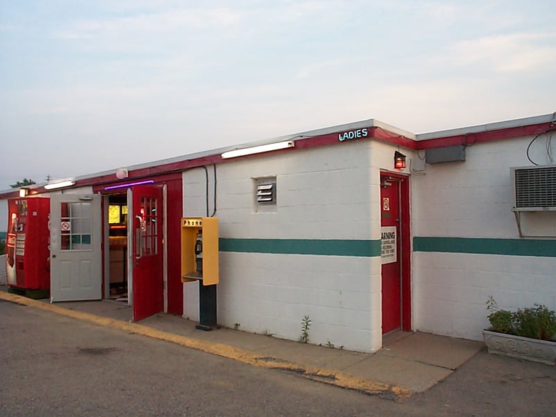 side view of snack bar with pay phone