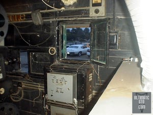 Kingman Drive-In, Delaware Ohio
GTOAA club meet event 7/7/2000
Sneaking around #2 the projectionist keeps an eye on things through this window. Since he stands up a lot, he's got some very
squishy carpet to stand on here.