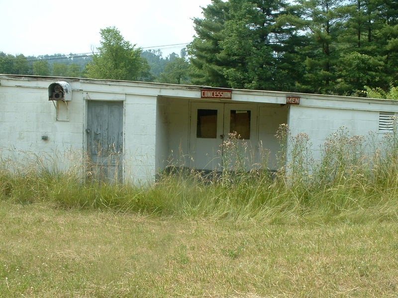 Right side view of the Snack Bar, with mens restrooms, consessions, and in the upper left hand corner, is that a transmitter to the old speakers?