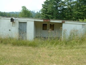 Right side view of the Snack Bar, with mens restrooms, consessions, and in the upper left hand corner, is that a transmitter to the old speakers?