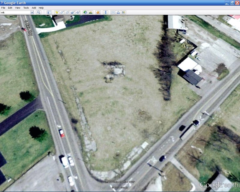 The Lima Drive-In was located on South Dixie Highway, on the Northeast corner of it and Breese Rd. The ruins of the projector building are at the center, with a few rows still visible. This theater closed in the '70s.