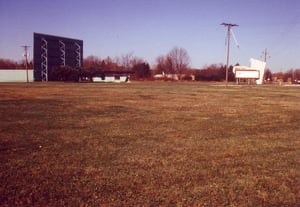 Picture showing front of Drive-In with marquee, ticket booth and main screen