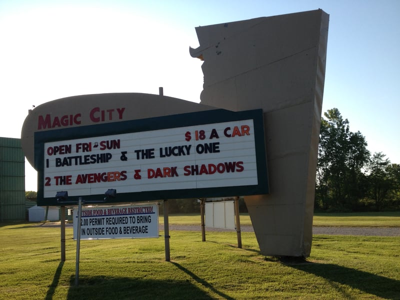 The Marquee with the 2012 ticket price of 18 a car.  Showing Battleship  The Lucky One on screen 1 and The Avengers  Dark Shadows on screen 2.