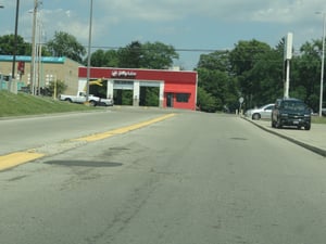 Entrance to strip mallKroger was once half of the drive-in entranceexit