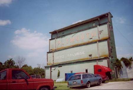 The former Plymouth Drive-In screen tower, now signage for the Plymouth Auto Salvage.