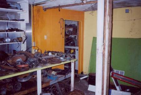 Inside the trashed snack bar, now littered with rusty flywheels.