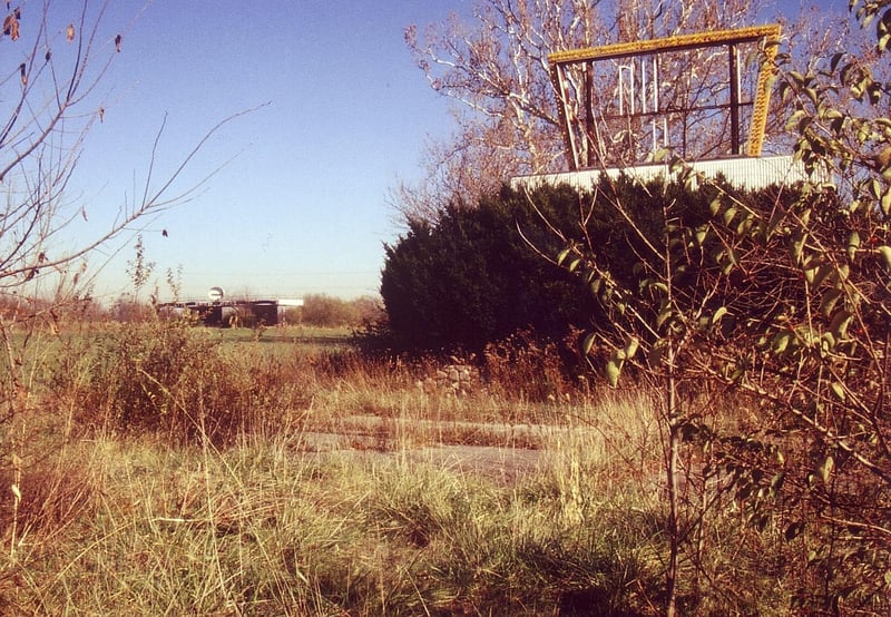 Very overgrown marquee. Ticket booths can
be seen in background