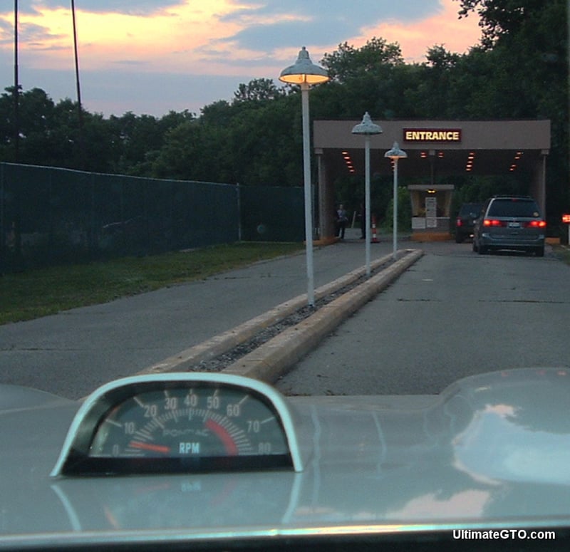 Driving down the lane toward the ticket window.