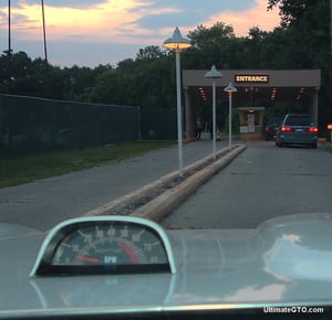 Driving down the lane toward the ticket window.