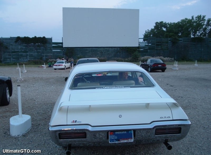 Our '68 GTO is in place before darkness falls. We're headed to the snack bar to see what they have for dinner. Some people bring their own food to drive-ins. We nevvver do that, preferring to help support the theater owners by purchasing their food and sn