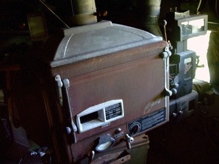 A lonely projector (still complete, as is it's sister next to it) hopes to show films once again. Someone please save this theatre!!