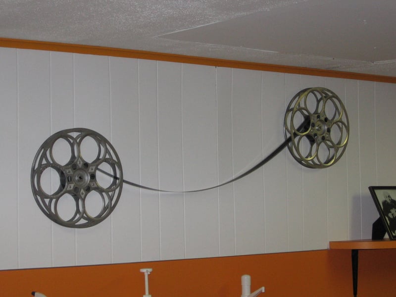 Film reel decorations on wall of snack bar wall.