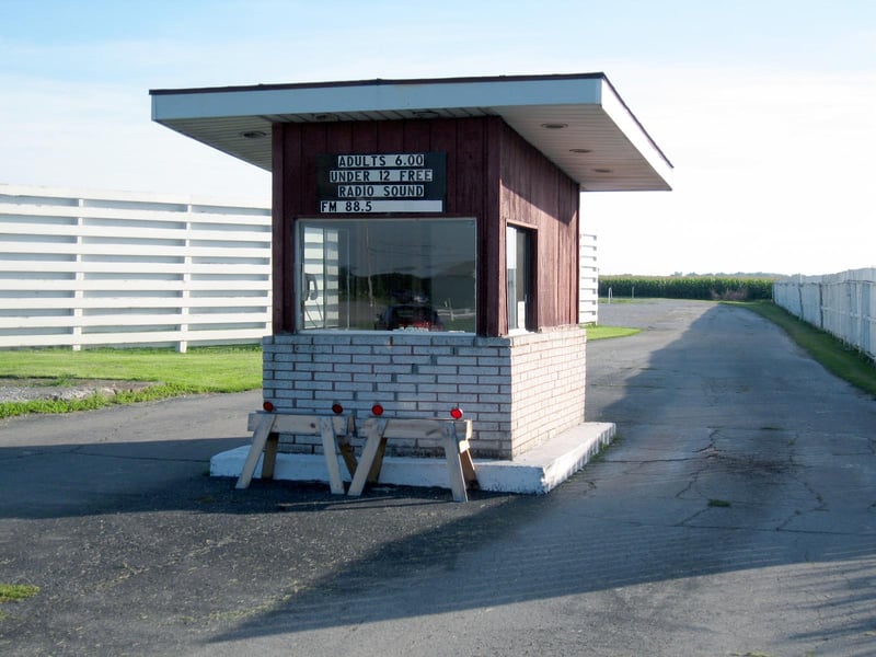 TICKET BOOTH. BOTH SIDES BEING WORKED ON BUSY FRIDAY.
