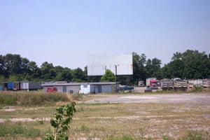 Concession, field, and screen. Notice the semi-trucks parked in the lot.