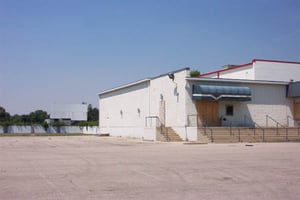 The Starglow Drive-In screen can be seen in the background behind the Towne East Cinemas indoor theater.