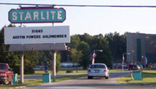 Entrance and marquee with what looks to be the screen tower in the background from Cinematour.com.