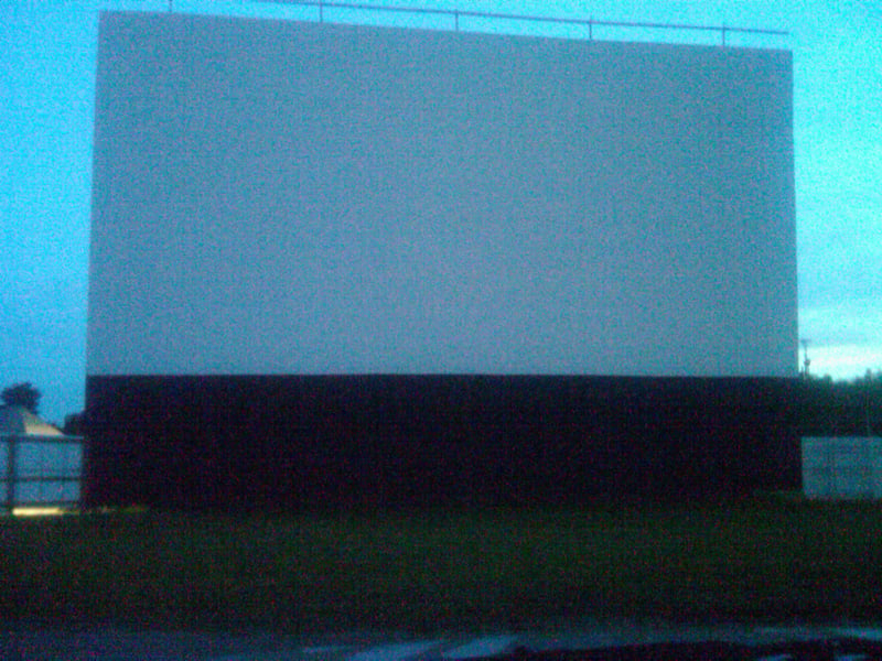 Screen before sunset from inside the lot.