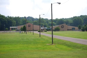 View from the road toward the site.  Except for the sign and driveway, it appears that the entire site was re-developed.