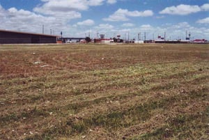 Another shot of the empty field behind Eddie Cordes Dodge large building at left