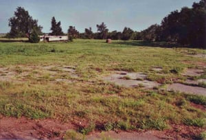Standing close to the entrance looking onto the field with the snack bar