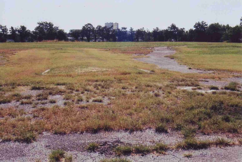 View from entrance towards field and screen location. Between the curb stones were the entrance and exit roads, the entrance probably was on the right