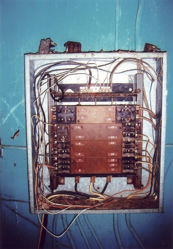 This device, hanging on the right wall inside the projection booth, probably is a fuse box