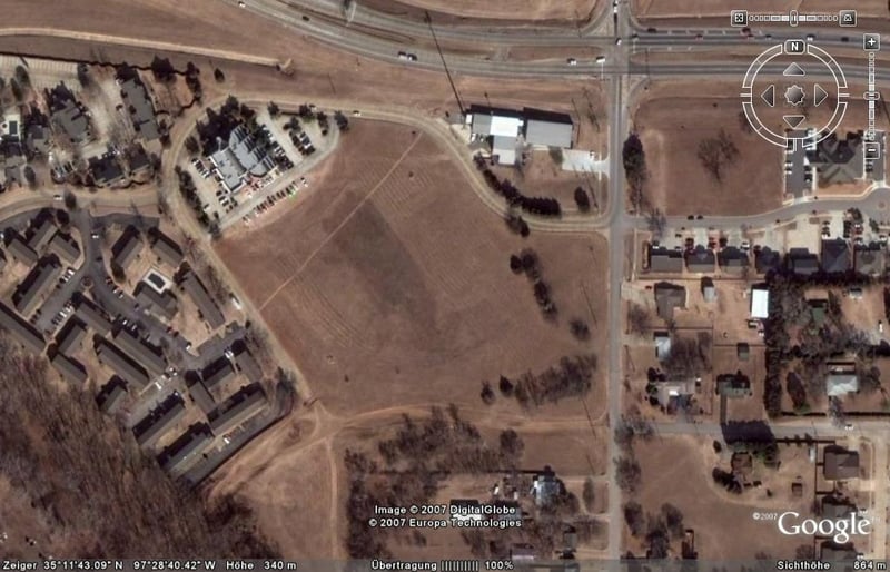 Aerial view of former drive-in site. The location of the screen was at the right where the two rows of trees meet