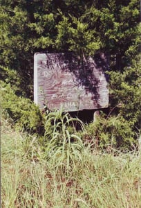 Weathered instruction board for tire guard:"Do not back up!"