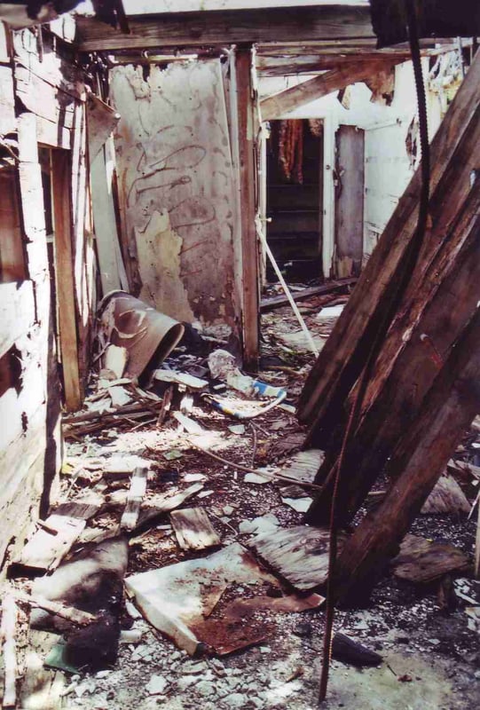 Messed up snack bar with open door leading into a storage room in background