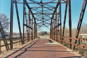 A more distant view of defunct Skyway theatre screen from old Bridge on Old, Old US 66 pavement, westof Sapulpa, OK.