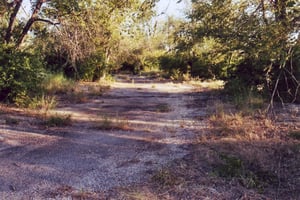 The lot used to be paved, the ramps still can be seen clearly