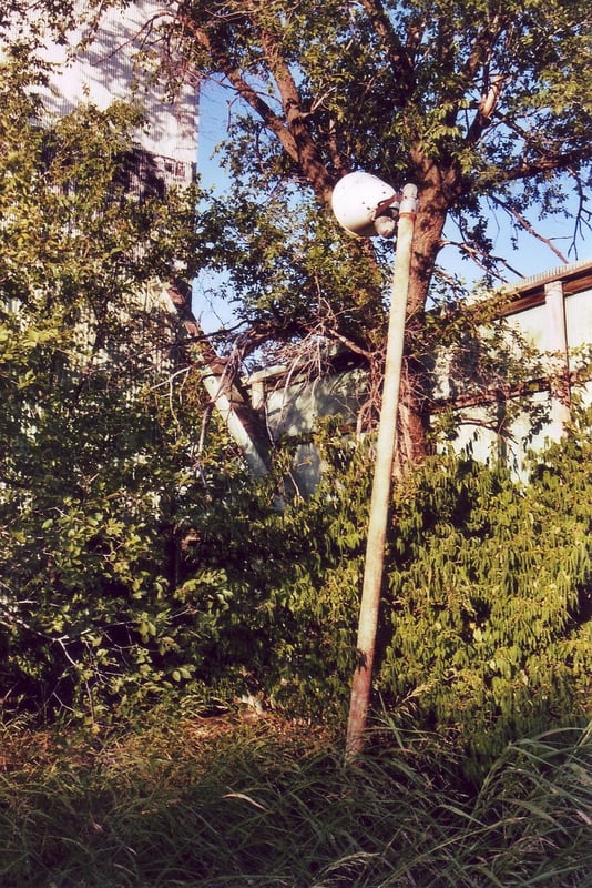 Remaining light in front of the right side of the screen. The exit road runs behind the piece of perimeter fence