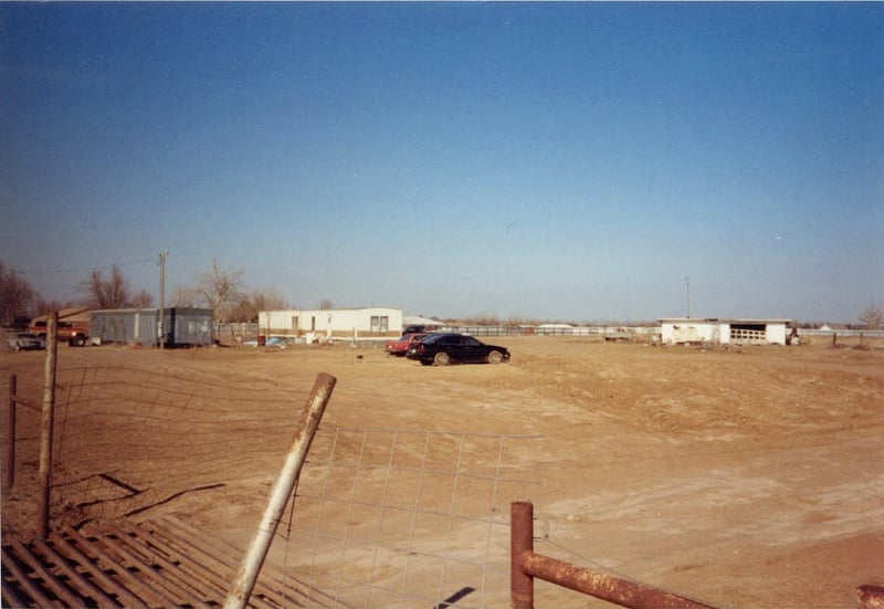 Taken from the southwest corner of the lot. The cattle guard is approximately where the theatre entrance was. The screen tower was located just adjacent to the north of the entrance, facing east ... slightly northeast. The projection/concession buildin
