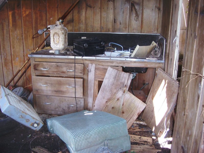 Damaged cabinet with sink in snack bar